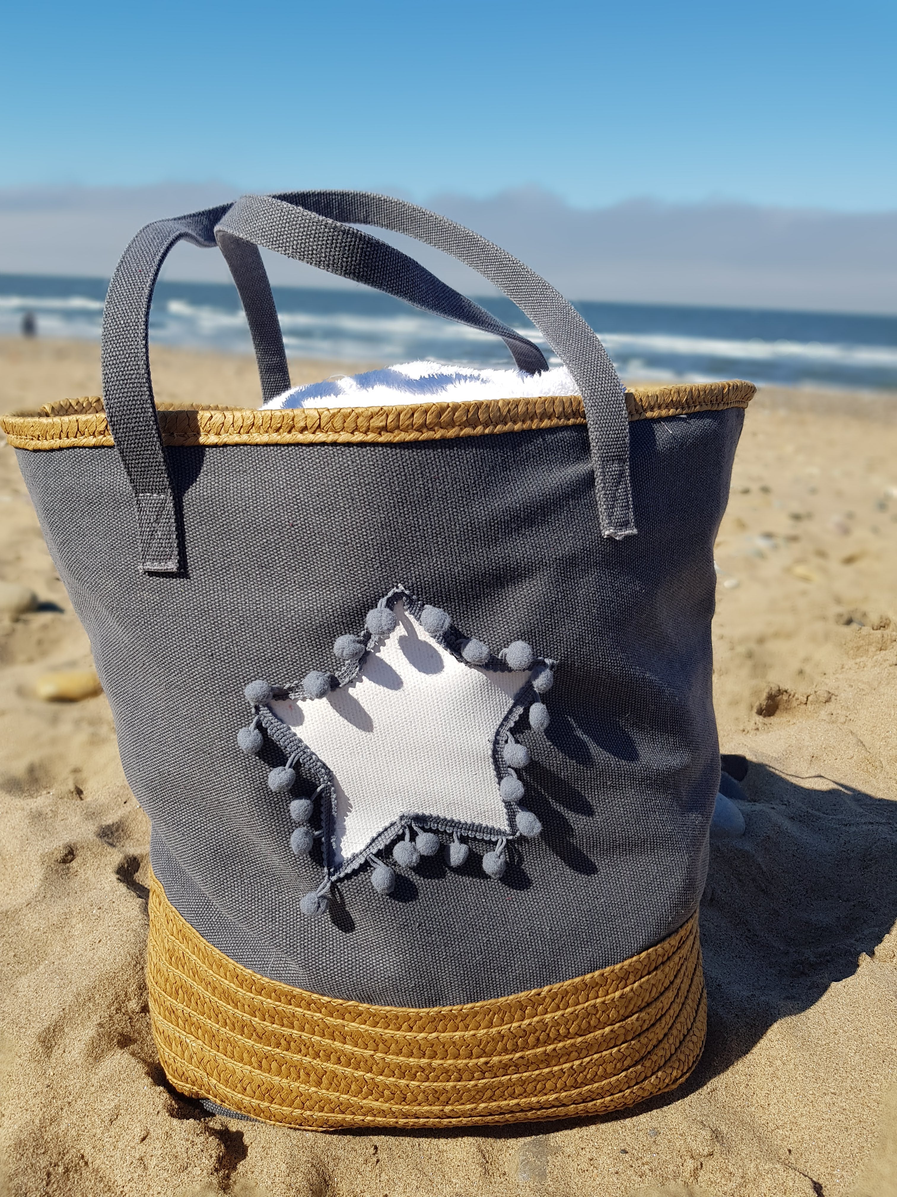 large beach bag organiser bag with a star pompom design oatmeal
