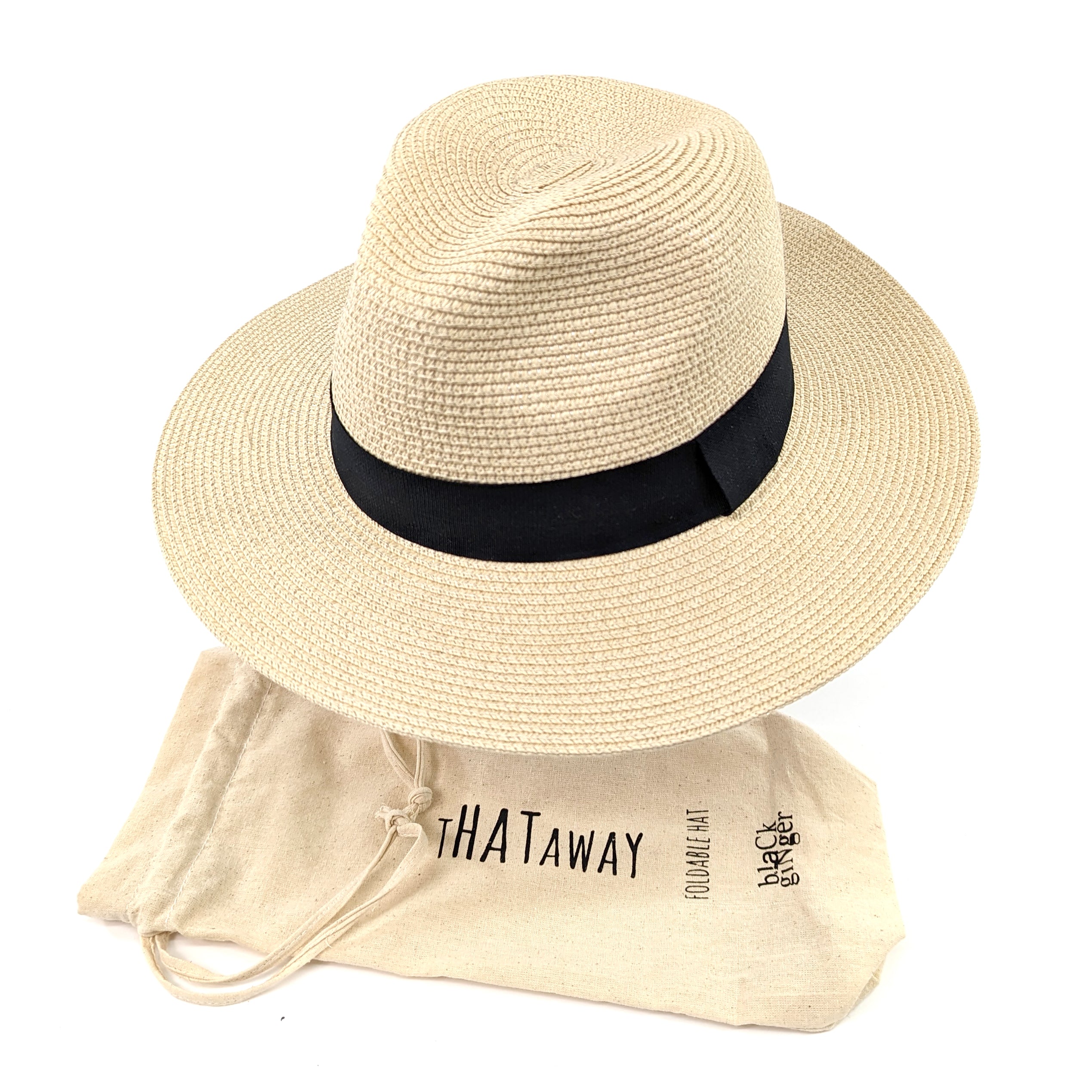 Foldable sun hat made of 100% paper straw sitting on a hat stand next to its travel bag. The hat has a 7cm brim for maximum sun protection, and the travel bag makes it easy to pack and take on the go.  59cm inner hat size